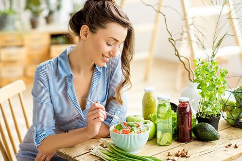 The girl eats salad